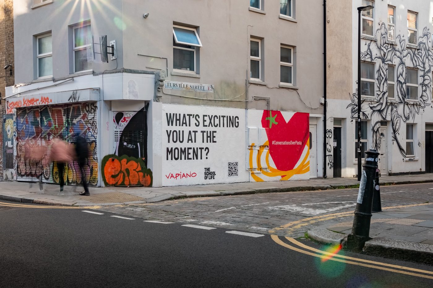 A wide painted wall dominating a Shoreditch street corner
